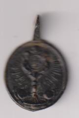 Inmaculada. Medalla (AE 23 mms.) R/ Cáliz superado de cabeza de ángel. Siglo XVII-XVIII