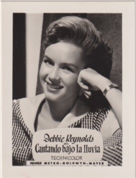 Debbie Reynolds en Cantando bajo la lluvia de MGM. Años 50. Al dorso. Publicidad de Rollfilm Infonal. Tarjeta Postal (9, 5 x7 c.) Impecable